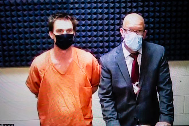 John Varndell Jr., left, appears via Zoom next to his attorney, Michael Boucher, during a pre-trial hearing Monday, Nov. 9, 2020. Varndell is facing multiple charges for allegedly shooting and killing Zachary Rock, his 11-year-old stepson, earlier this month.