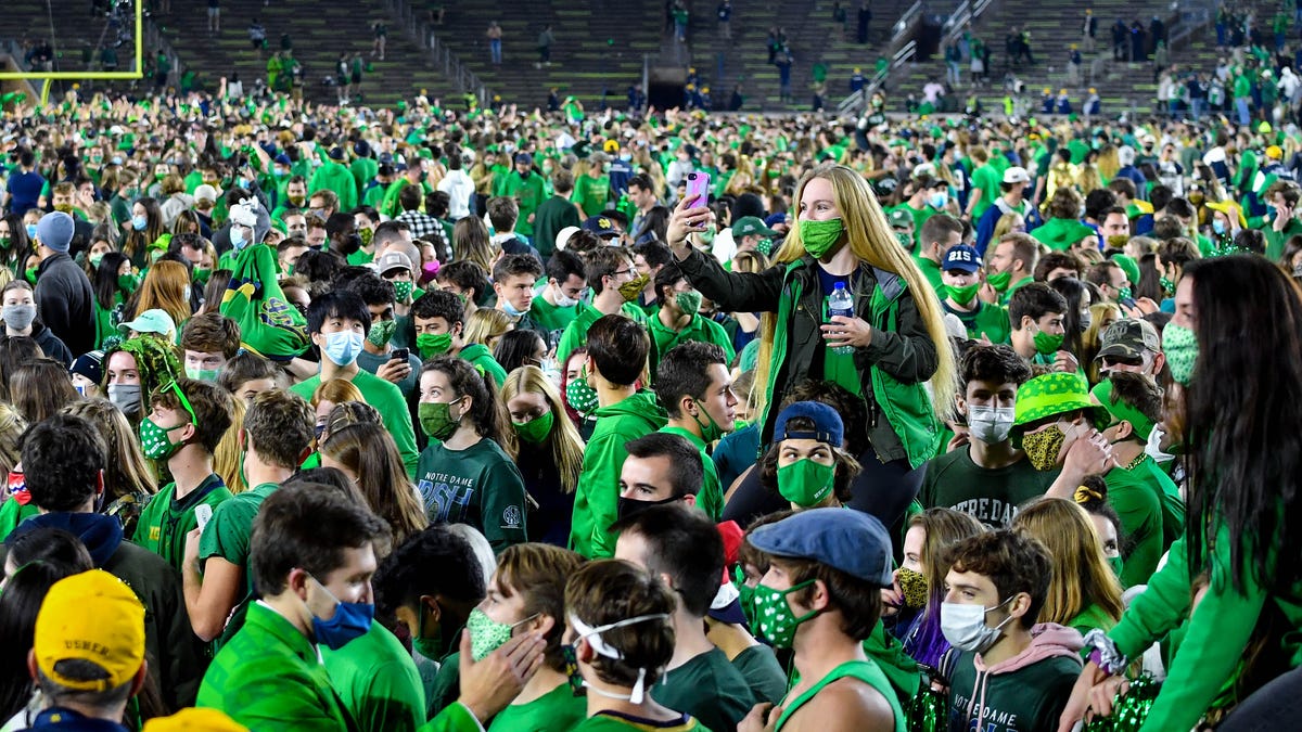 Fans storm the field after Notre Dame defeated then-No. 1 Clemson in two overtimes.