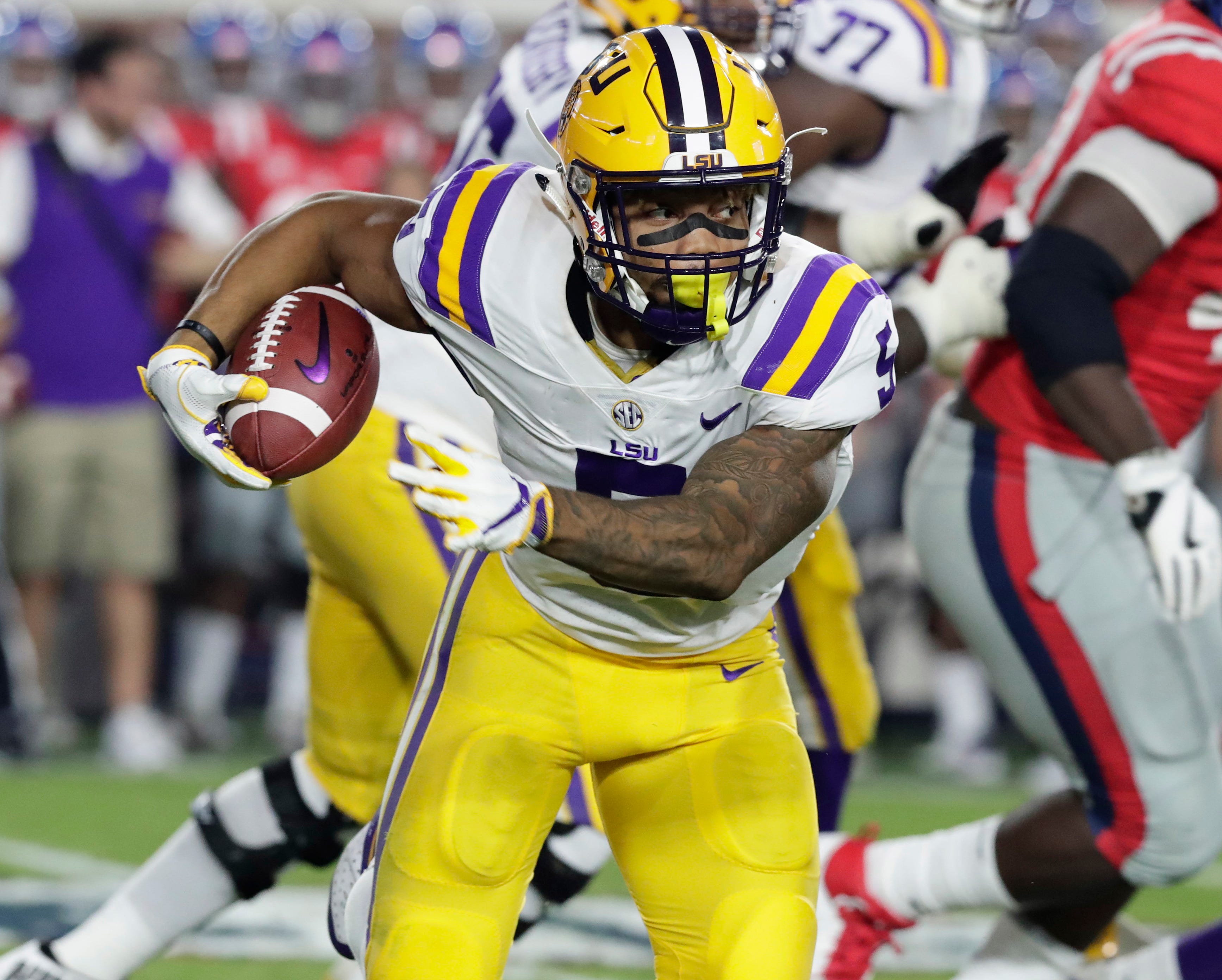 In this 2017 file photo, LSU running back Derrius Guice plays during an NCAA college football game in Oxford, Miss.