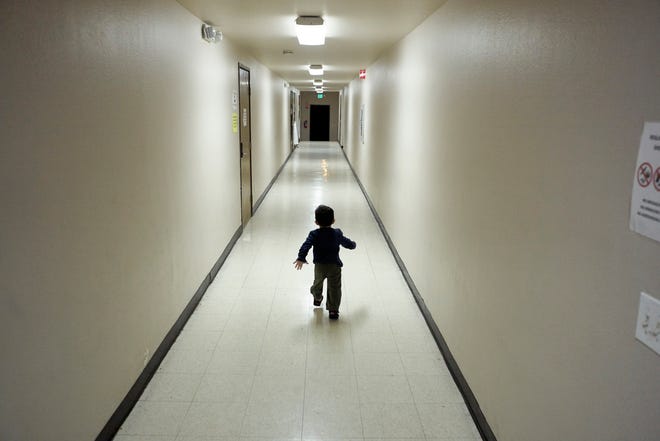 An asylum-seeking boy from Central America runs down a hallway after arriving from an immigration detention center to a shelter in San Diego on Dec. 11, 2018.