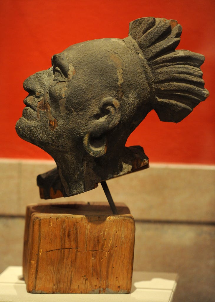 The wooden head likeness of Native American Squanto, which is the only surviving piece of the wooden pediment that was installed on the Pilgrim Hall Museum building in 1880.