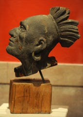 The wooden head likeness of Squanto, the only surviving piece of the wooden pediment that was installed on the Pilgrim Hall Museum building in 1880.