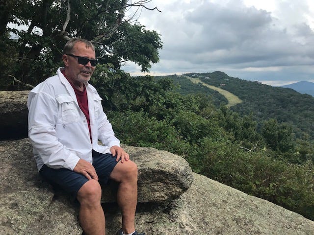 Gregg Patterson rests up after a mountain hike in North Carolina.