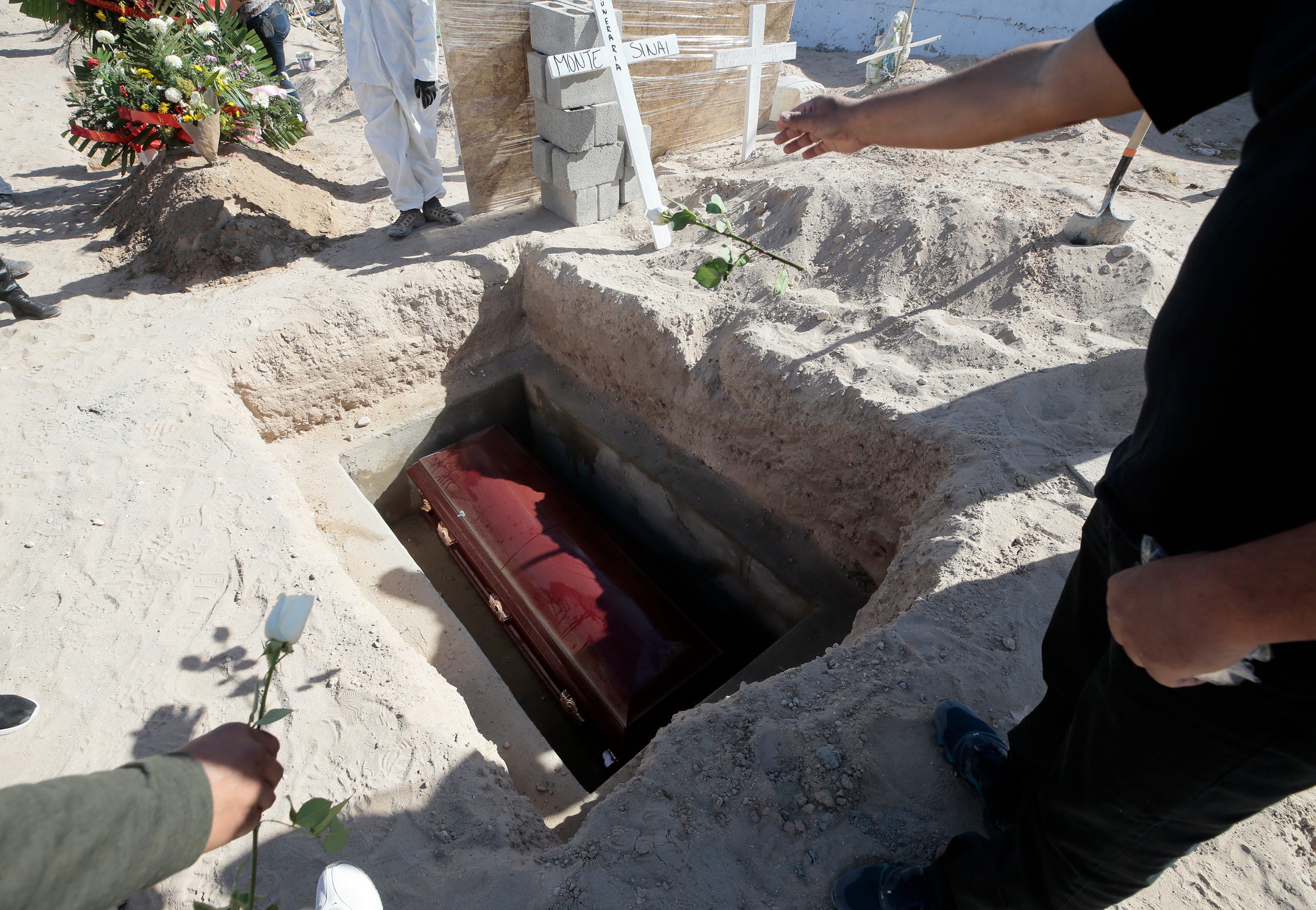 A small cemetery in south Juarez is taking extra precautions when burying those who died from Covid-19. The caskets are entombed in concrete and then covered with several feet of sand.