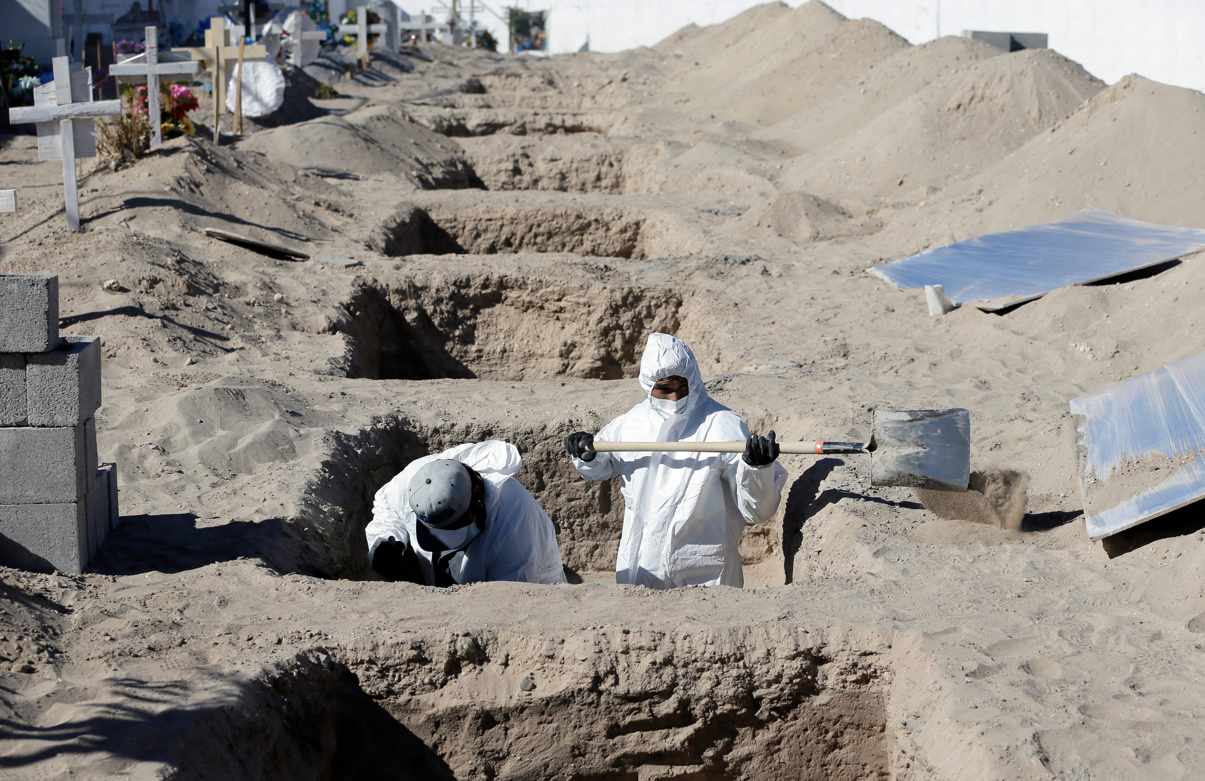 A small cemetery in south Juárez is taking extra precautions when burying those who died from coronavirus. The caskets are entombed in concrete and then covered with several feet of sand.