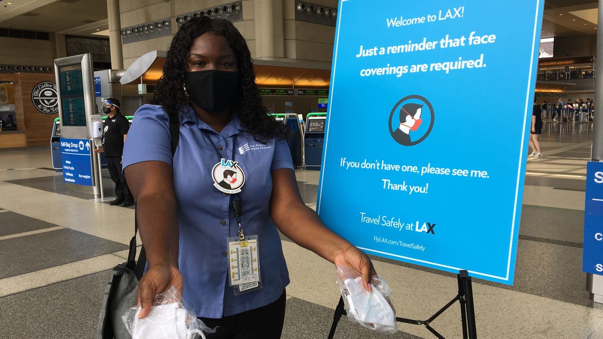 At Los Angeles International Airport, Travel Safety Ambassadors patrol select terminals to remind guests about the airport's mask policy and hand out free face coverings if needed.