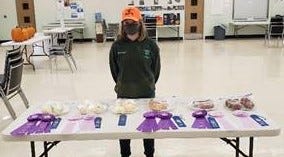 Exhibitor Michaela Reed, Bethany 4-H Club, with her Onion and Potato entries in this year’s Roundup.