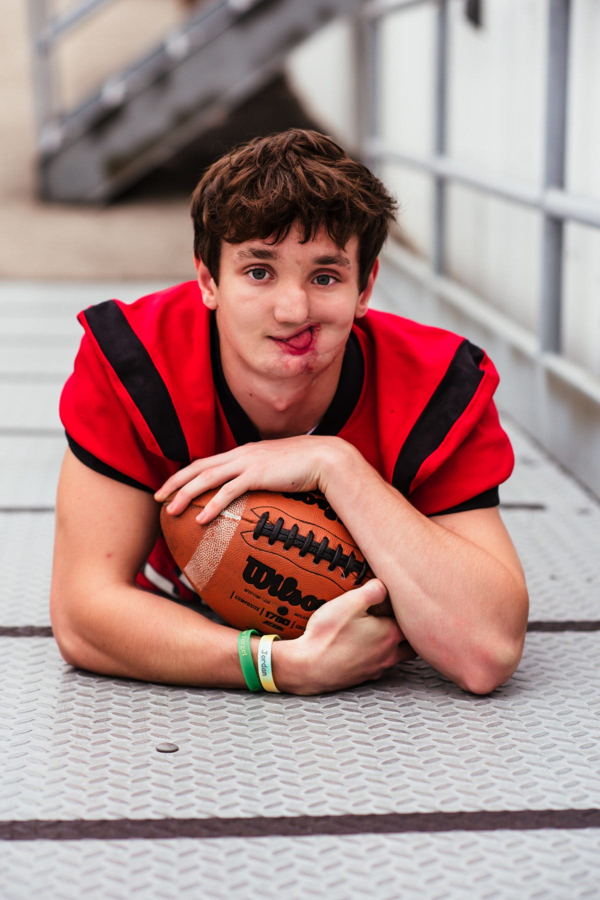 Carson Molle poses for a senior picture wearing his Seymour High School football uniform.