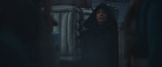 Koska Reeves (Mercedes Varnado) lurks in the shadows in the Disney+ "Star Wars" series "The Mandalorian."