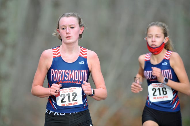 Portsmouth's Abby Gilpin, left, stays a few steps ahead of teammate Katie Yalanis in the early stages of the state meet Saturday at Ponaganset High School.