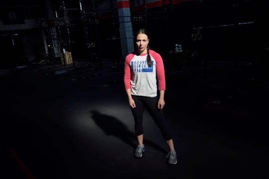 CrossFit Golden Gate owner Danielle Rabkin poses for photos at her gym in San Francisco, Thursday, Nov. 12, 2020. State and local health officials are blaming private gatherings for a surge in California coronavirus cases to levels unseen in months. That has business owners and some health experts scratching their heads over why the state's response has instead been to impose more restrictions on businesses like restaurants and gymnasiums in areas that have been backsliding.