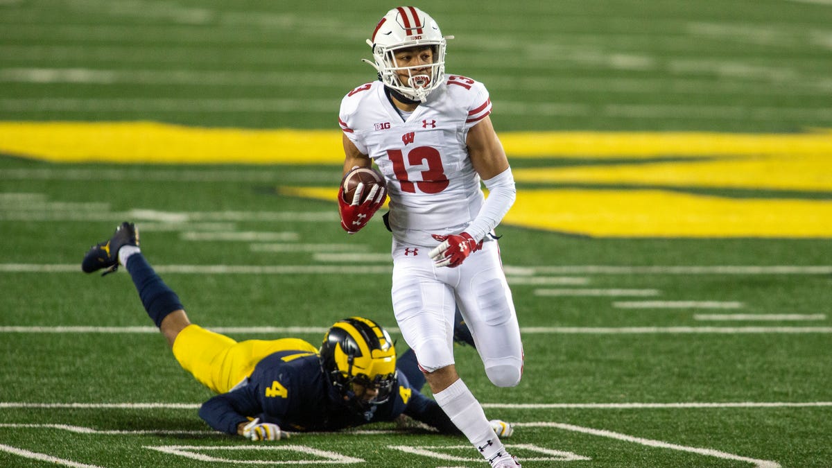 Wisconsin receiver Chimere Dike (13) gets away from Michigan defender Vincent Gray (4).