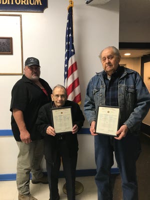 Kevin Mark honors WWII veteran Theodore Conrad and Korean War veteran Norbert Lang.
