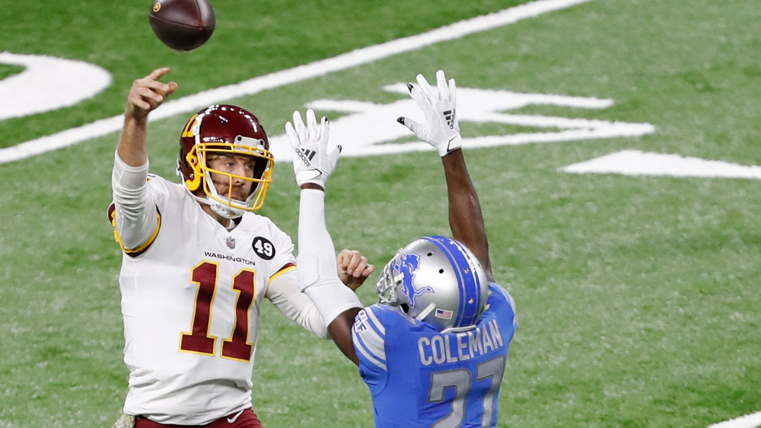 Washington Football Team quarterback Alex Smith (11) passes the ball over Detroit Lions cornerback Justin Coleman (27) during the first quarter Nov. 15, 2020, at Ford Field.