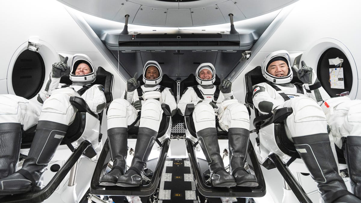 This undated photo made available by SpaceX in September 2020 shows, from left, NASA astronauts Shannon Walker, Victor Glover, commander Mike Hopkins and Japan Aerospace Exploration Agency astronaut Soichi Noguchi inside SpaceX's Crew Dragon spacecraft. The four are scheduled to be SpaceX's second crew launch in mid-November 2020. (SpaceX via AP) ORG XMIT: NY561