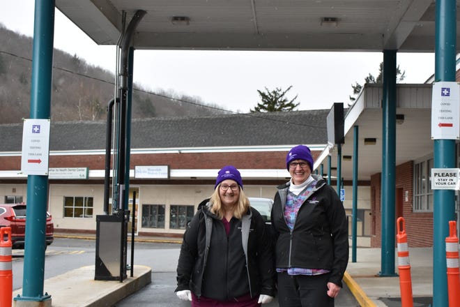 Lab Technologists Holly Meyer (left) and Nancy O’Connell at the COVID-19 drive-through testing site at the Stourbridge Complex, Honesdale before dressing in their PPE.