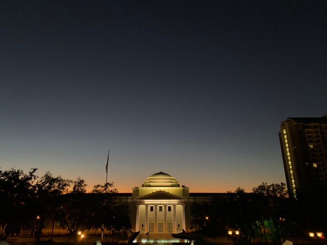 The sun sets behind the Florida Supreme Court building Monday, Nov. 16, 2020.