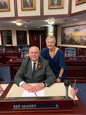 New District 4 State Rep. Patt Maney poses in the Florida House of Representatives chamber with wife, Caroline, following his swearing in ceremony in Tallahassee Tuesday. Maney replaces outgoing Rep. Mel Ponder, who was elected to the Okaloosa County Commission in November.
