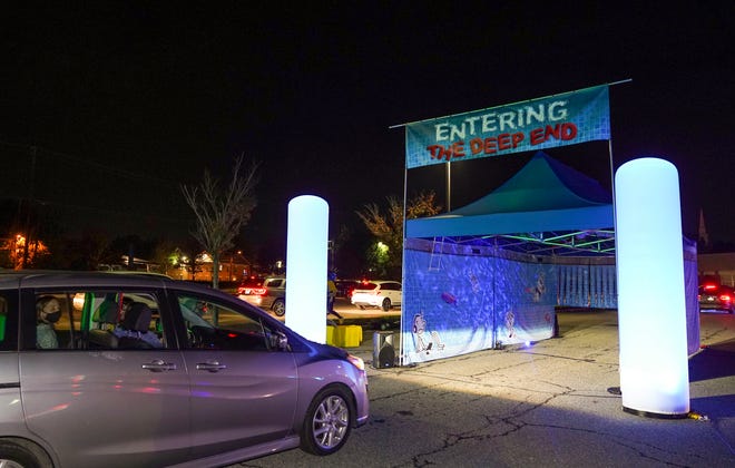 Families attend a drive-through pool-party event promoting Jeff Kinney's latest kids book, "Diary of A Wimpy Kid: The Deep End" on Oct. 26. in Silver Spring, Maryland.