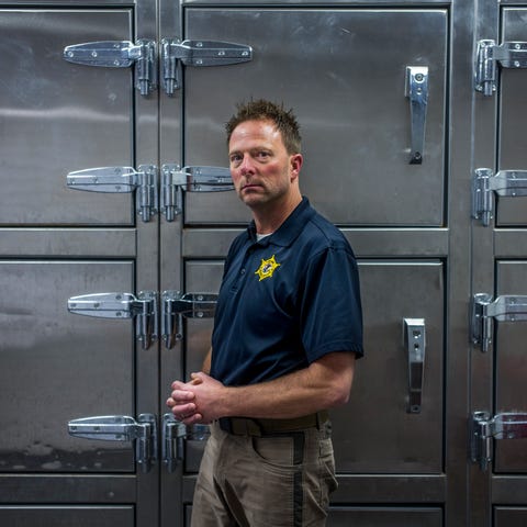 Peoria County Coroner Jamie Harwood stands in the 