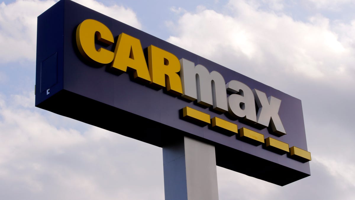 A sign at the CarMax dealership in Manchester, N.H., from 2019. A proposed CarMax in Victorville drew opposition from local auto dealers during a City Council meeting on Tuesday, Nov. 17, 2020.