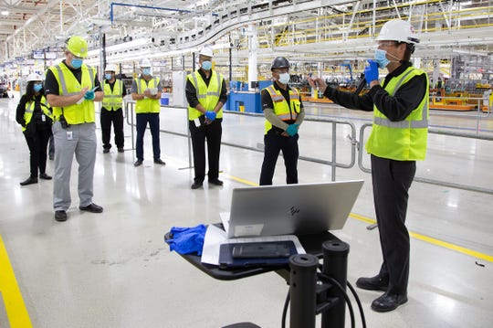 Mack Plant Manager Michael Brieda (right) conducts a daily operations meeting with his management team in the body shop of the new plant. FCA is investing $1.6 billion to build the first new assembly plant in nearly 30 years in Detroit, bringing 3,850 new jobs to the city.