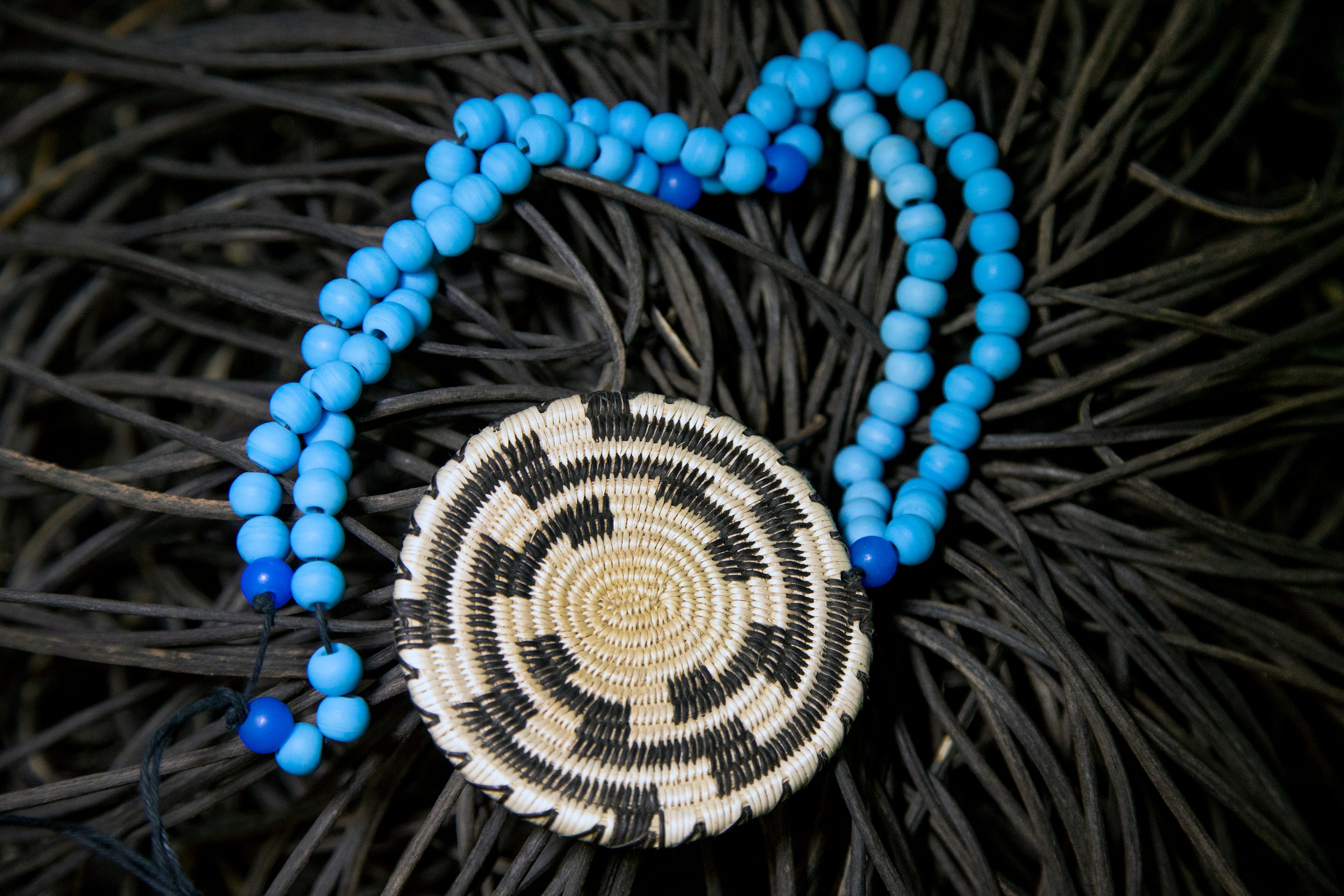 Basket weaver August Wood uses natural materials for his creations. He finds willow and cattail along the river and he grows his own devil's claw.