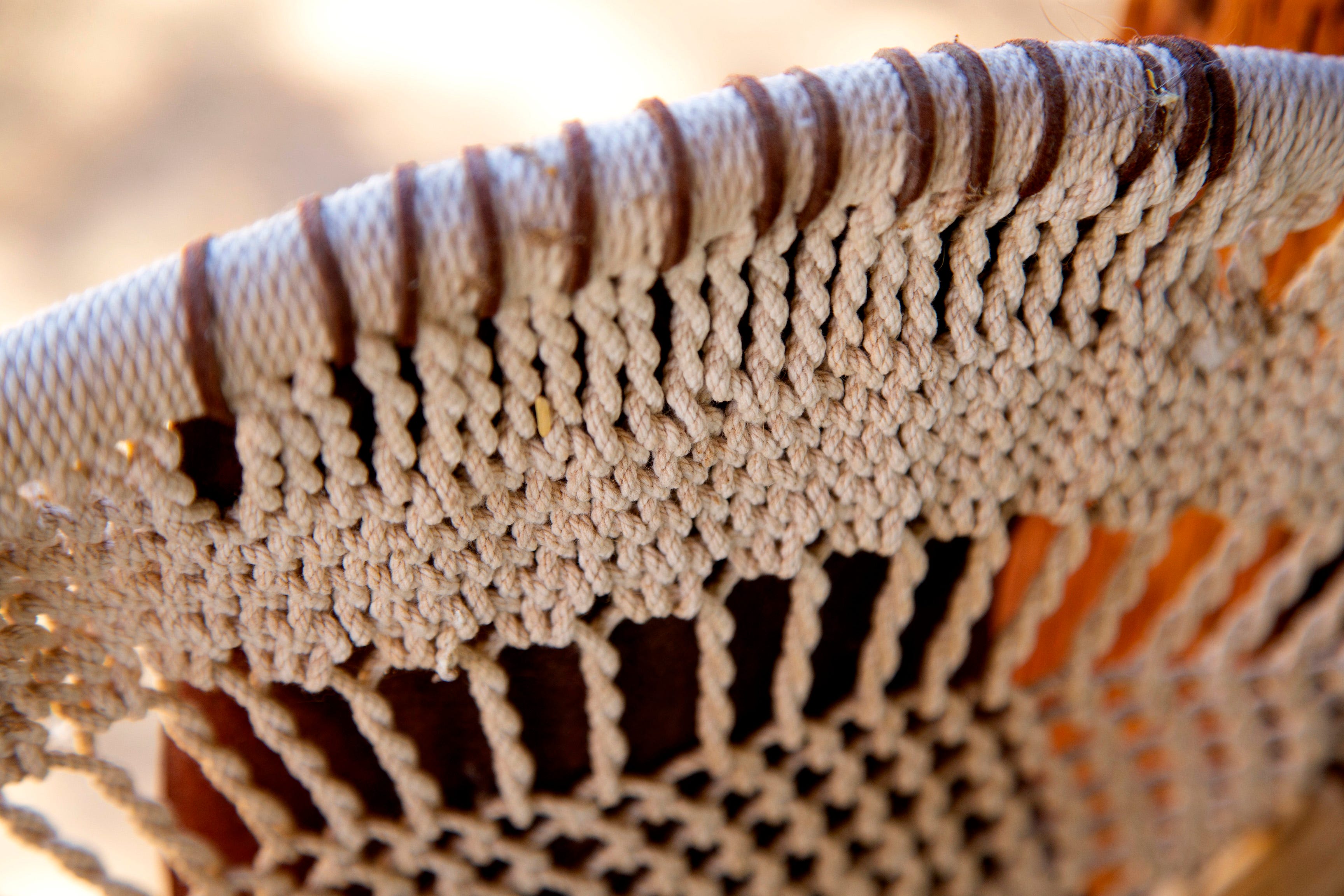 Royce Manuel, Salt River Pima-Maricopa Indian Community elder, uses traditional materials create bow, arrows, baskets, and flutes. Tribal artisans, cultural practitioners are experiencing issues in finding the natural materials they need.