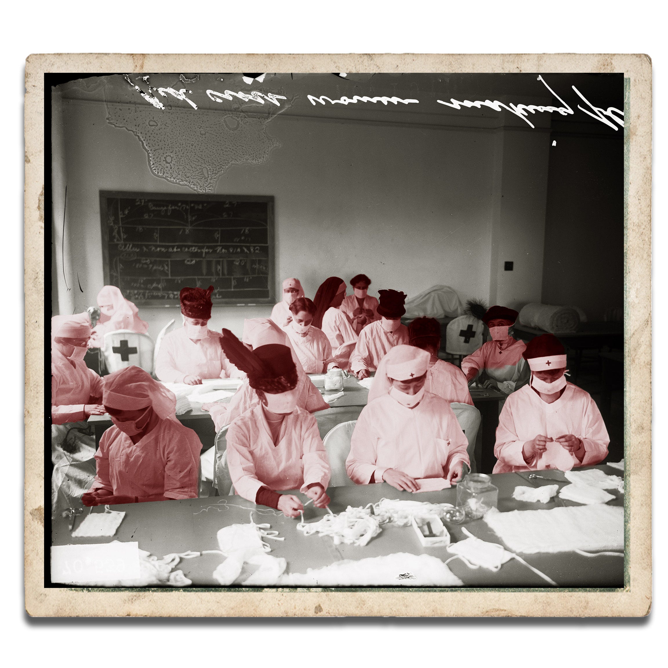Red Cross Women sit at long tables making influenza masks in Chicago, Illinois in 1918.