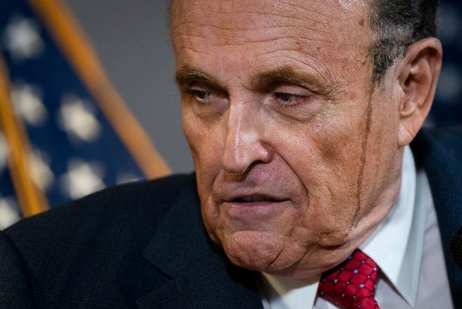 Rudy Giuliani speaks to the press about various lawsuits related to the 2020 election on Nov. 19 inside the Republican National Committee headquarters.