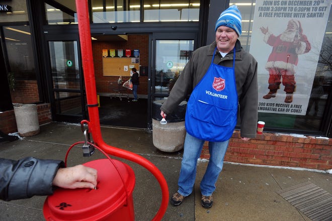 Stu Whitney volunteers for the Salvation Army outside of the HyVee at 26th Street and Marion Road on Friday, Dec. 19, 2014.
