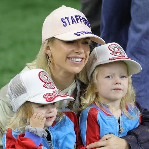 Kelly Stafford on the sideline with her twin daugh
