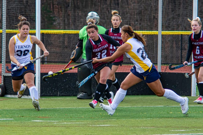 Vernon's Julia Gregory (26) and Alyssa VanDalinda (38) chase the airborn ball along with Morristown-Beard's Sydney Strollo (32) at the Girl's Field Hockey Championship between Morristown-Beard and Vernon at Vernon High School in Vernon, November 21, 2020. (Photo by Warren Westura for the New Jersey Herald)
