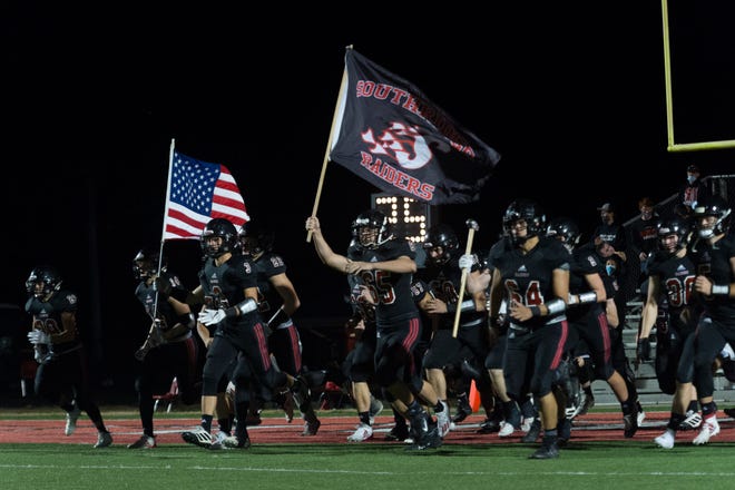 The Southridge Raiders take the field ahead of their Class 3A semistate game against the Danville Warriors in Huntingburg, Ind., Friday evening, Nov. 20, 2020.