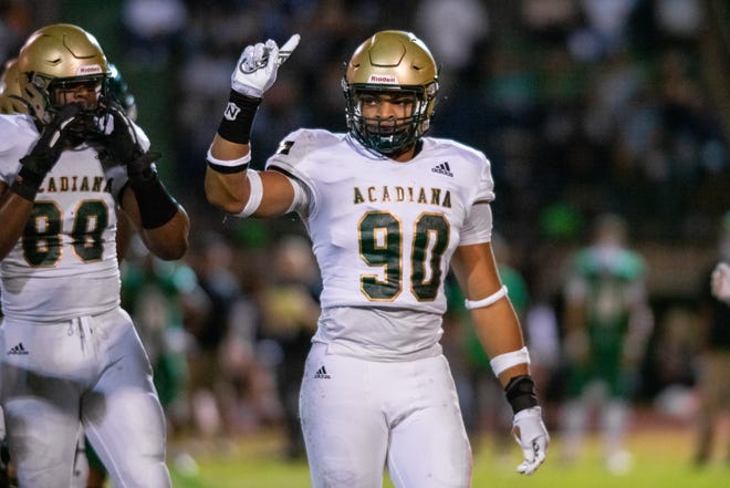 Acadiana high's Cameron George celebrates his quarterback sack after the play as the Lafayette high Mighty Lions take on the Acadiana high Wreckin' Rams at home on Friday, Nov. 20, 2020.