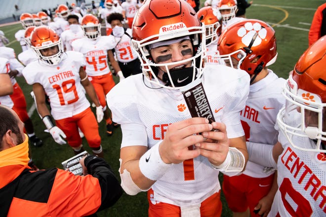 Central York's Beau Pribula holds up a Hershey's Chocolate Bar after the Panthers defeated McDowell 37-21 in the PIAA Class 6A semifinal at Mansion Park Stadium on Saturday, November 21, 2020 in Altoona, Pa. The Panthers will play St. Joseph's Prep in the championship game at Hersheypark Stadium this weekend.