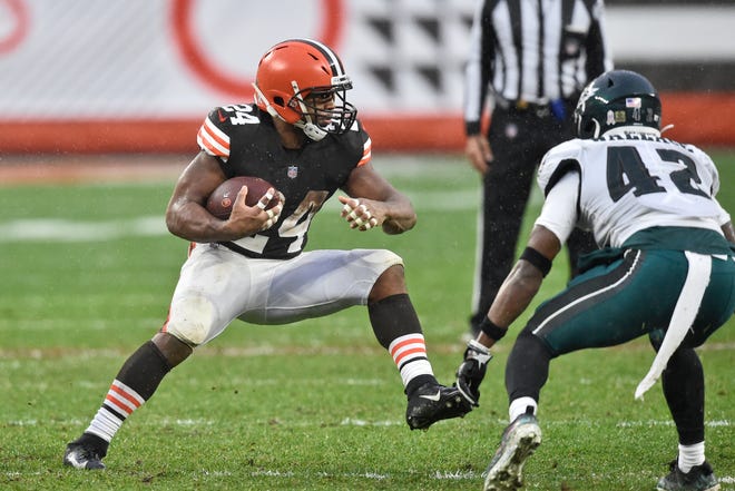 Browns running back Nick Chubb (24) rushes against Philadelphia Eagles safety K'Von Wallace (42) during the second half of a game, Sunday, Nov. 22, 2020, in Cleveland. (AP Photo/David Richard)