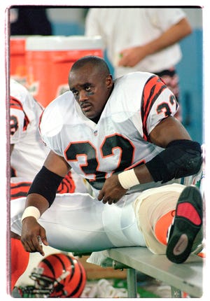 Cincinnati Bengals running back Ki-Jana Carter sits on the bench with his left knee iced after getting injured on his third carry of the game against the Detroit Lions during his NFL debut Thursday, Aug. 17, 1995, in Pontiac, Mich.