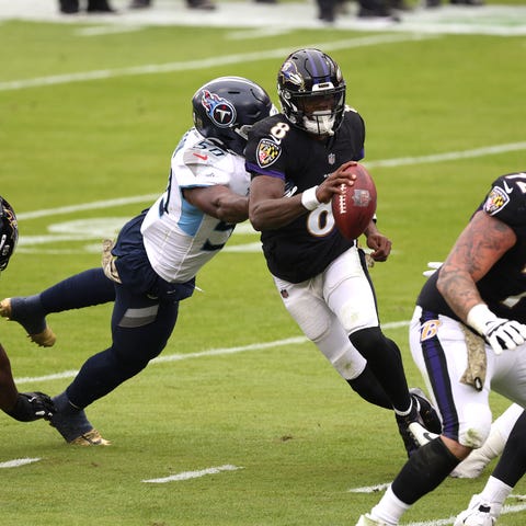Ravens quarterback Lamar Jackson scrambles against