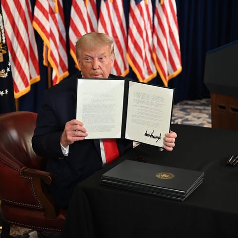 President Donald Trump signs executive orders on A