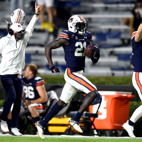 Auburn defensive back Smoke Monday returns an inte