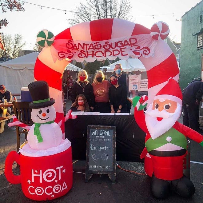 A giant inflatable Santa and snowman greet you at the Grant Street Cafe Biergarten.