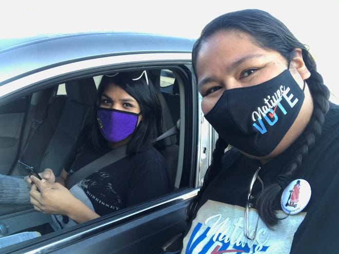 Gabriella Cázares-Kelly poses for a picture with a Tohono O’odham trans woman who drove an hour to volunteer for her campaign for Pima County Recorder.