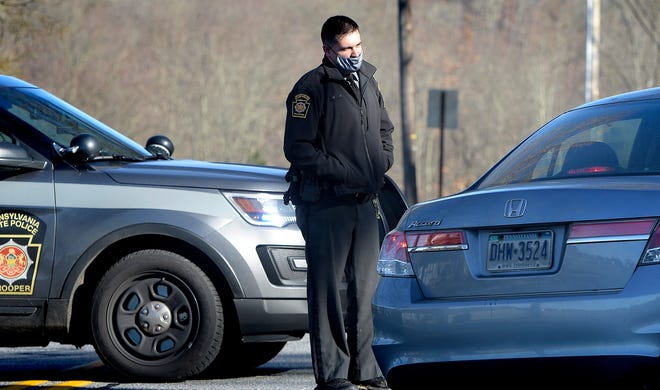 A state police trooper diverts traffic on Hess Farm Road near Lake Redman on Monday, Nov. 23, 2020. State police said they searched the area but were unable to find Felton-area man Scott A. Baker, who has been missing since Nov. 17, 2020, and who was last seen at William Kain County Park.
(Bill Kalina photo)