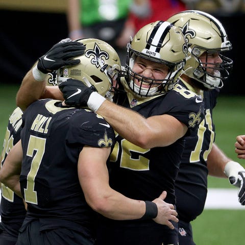 Taysom Hill of the New Orleans Saints celebrate hi