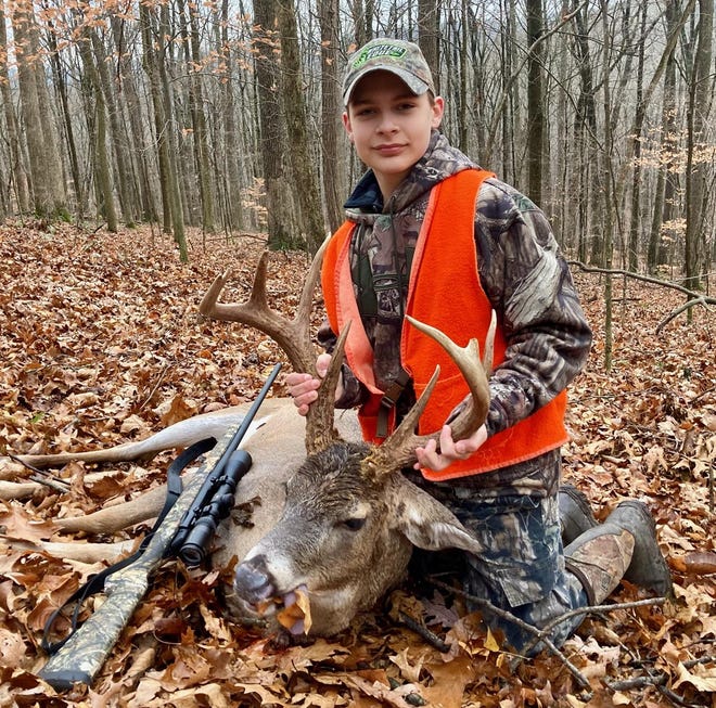 Wyatt Myers displays the buck he bagged on his first hunt with a rifle during Ohio young hunters weekend, Nov. 21-22. The state's young hunters checked 5,795 white-tailed deer during the two-day youth gun season, according to the Ohio Department of Natural Resources (ODNR) Division of Wildlife.