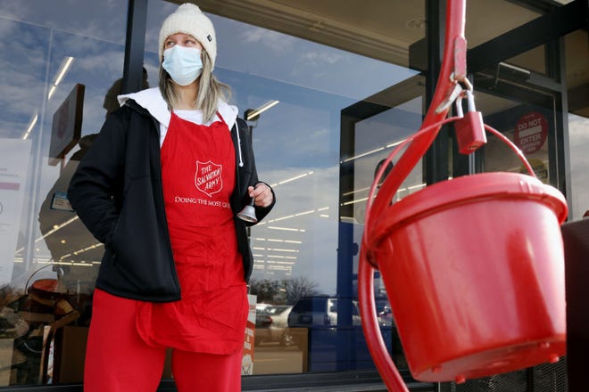 Volunteer Salvation Army bell ringer Laurenn Beach works her shift Nov. 23 in front of the Fareway grocery store in Burlington. The Salvation Army’s Red Kettle Campaign is the organization’s largest fundraiser.