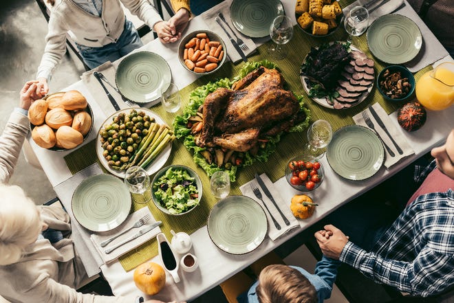A new national survey by the Ohio State University Wexner Medical Center shows many Americans plan on attending large holiday gatherings despite spiking COVID-19 cases and hospitalizations. (Dreamstime/TNS)
