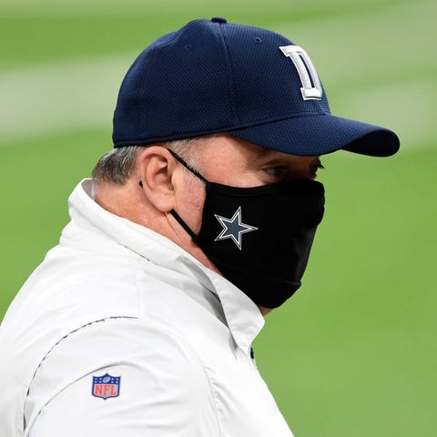 Head coach Mike McCarthy of the Dallas Cowboys loo