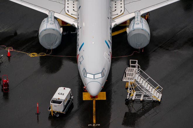 A Boeing 737 MAX airplane sits parked at the company's production facility on Nov. 18 in Renton, Washington. The U.S. Federal Aviation Administration (FAA) cleared the Max for flight after 20 months of grounding. The 737 MAX has been grounded worldwide since March 2019 after two deadly crashes in Indonesia and Ethiopia. (David Ryder/Getty Images)